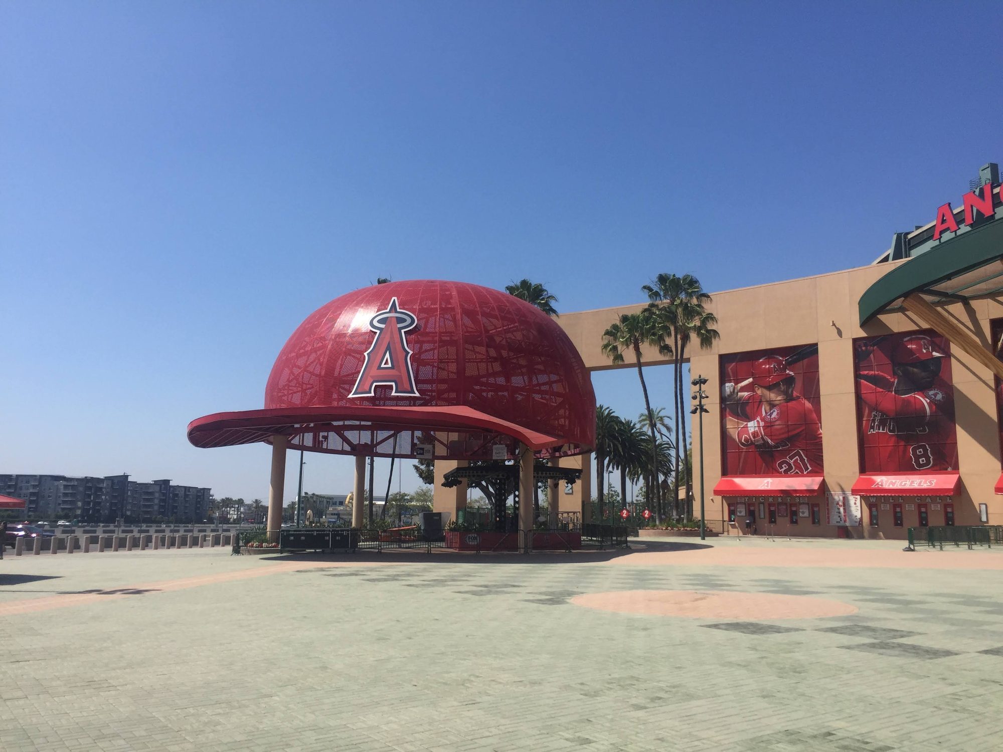 The giant Angels cap pavilion on the plaza outside Angel Stadium, player banners on the stadium wall behind