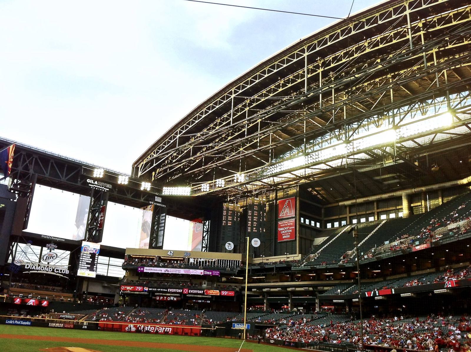 The bowl at Chase Field with the retractable roof overhead and the videoboards above the outfield seats