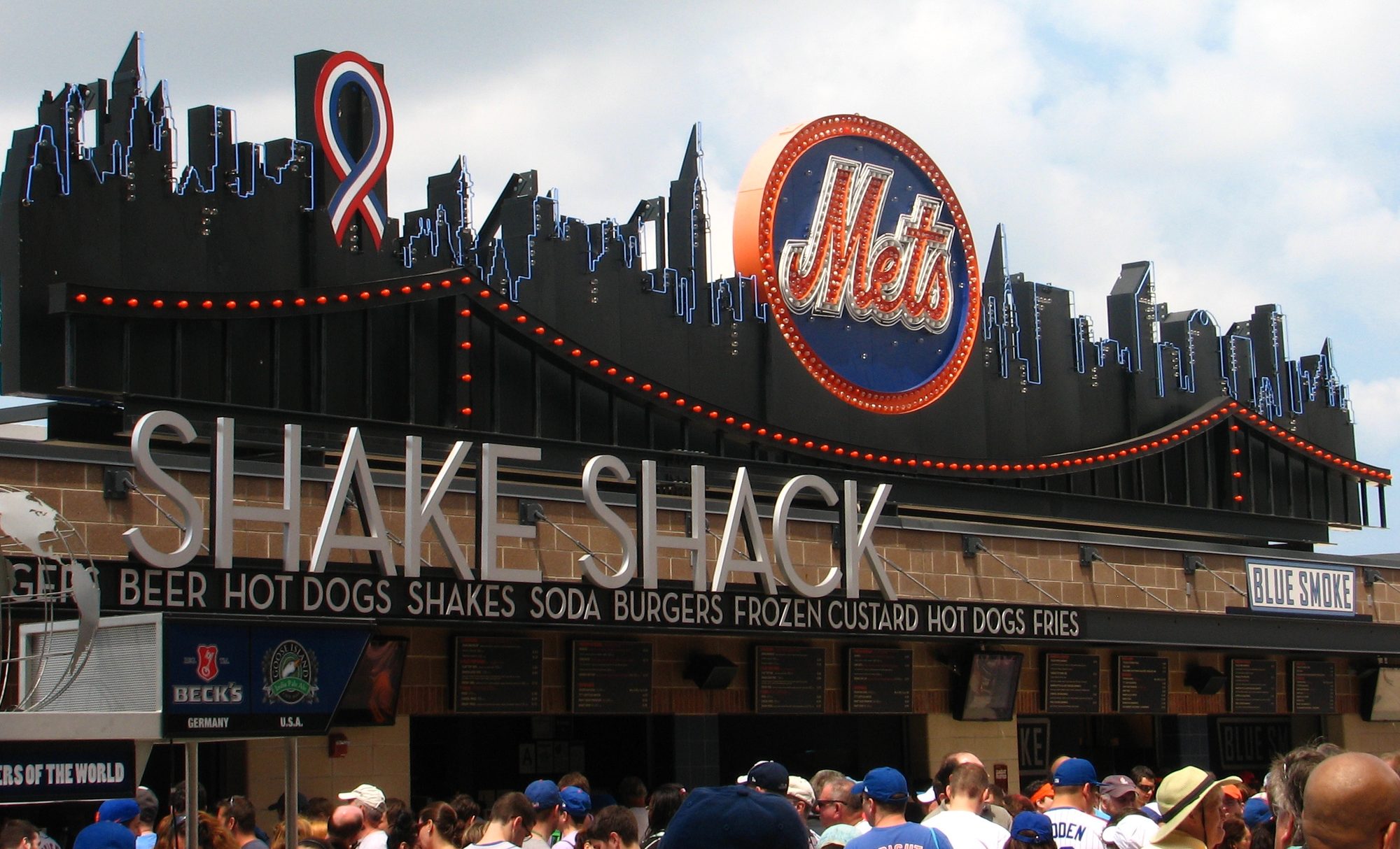 The Shake Shack marquee behind center field at Citi Field, the old Shea skyline silhouette and Mets sign above it