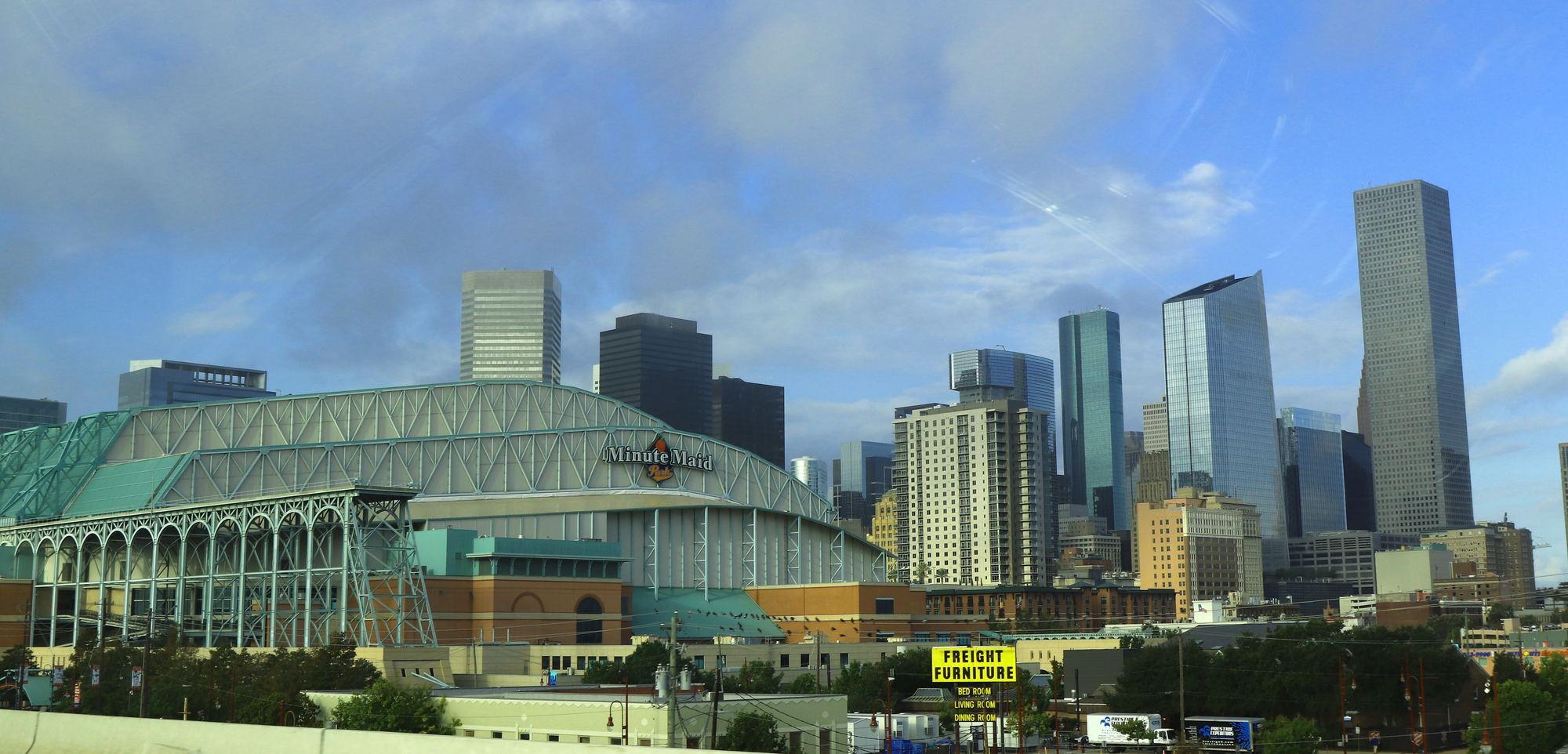 Daikin Park and the downtown Houston skyline on a sunny day