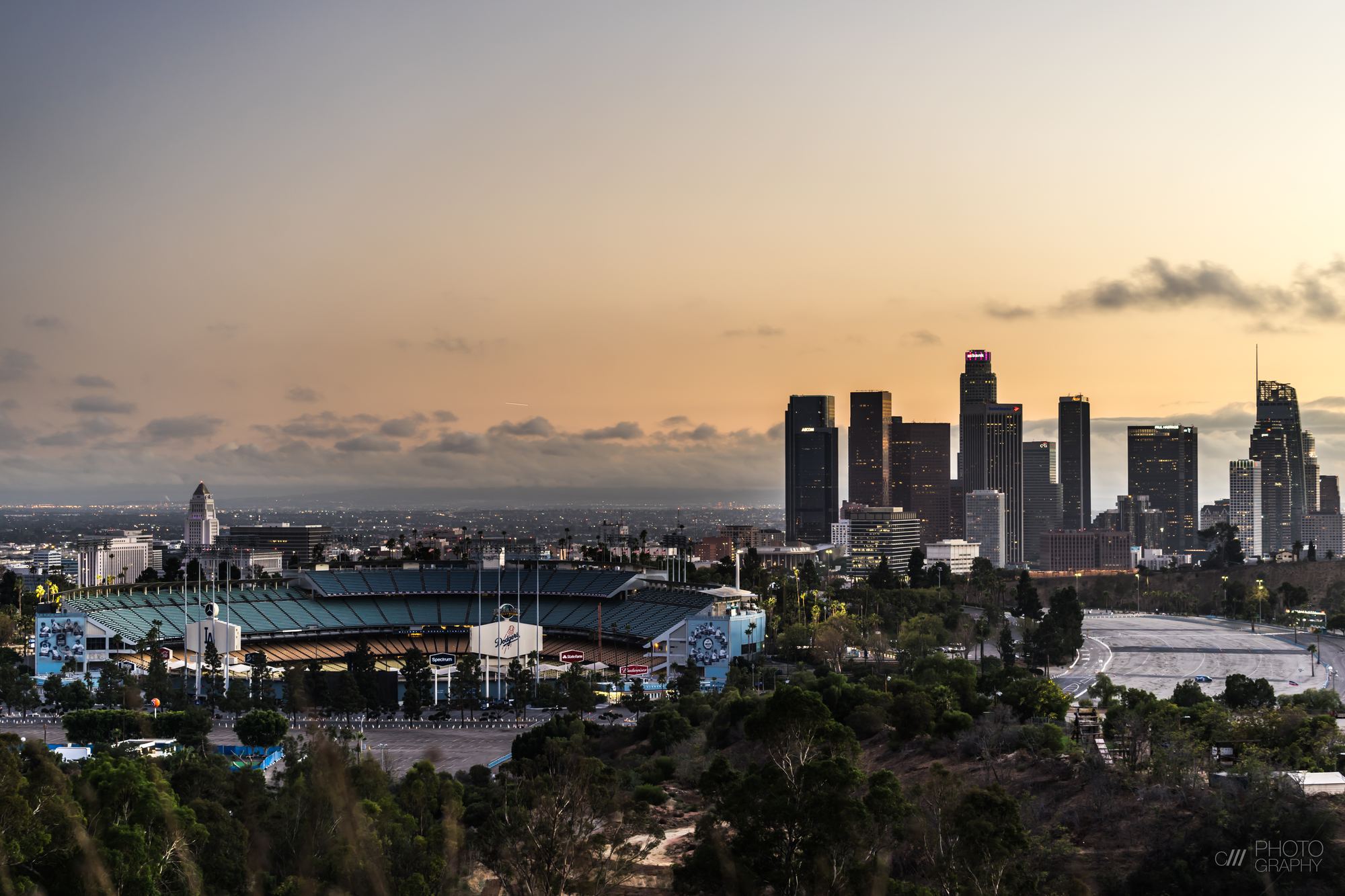 Dodger Stadium and the downtown Los Angeles skyline at sunset