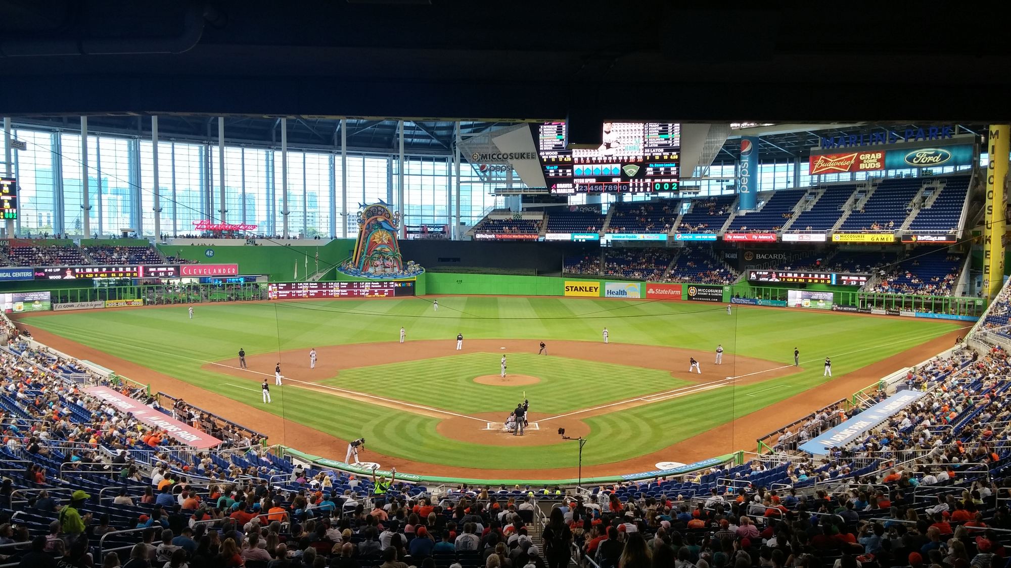 The field at loanDepot park with the glass wall open to the Miami skyline