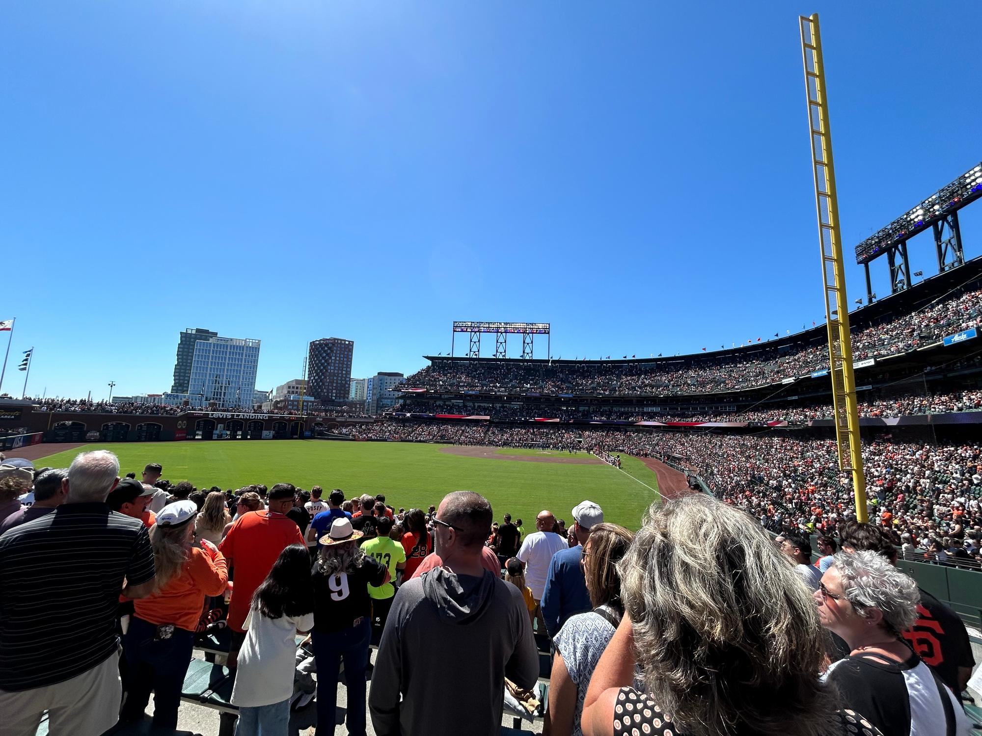 The view from Oracle Park's outfield seats across the right-field arcade toward McCovey Cove and the San Francisco skyline