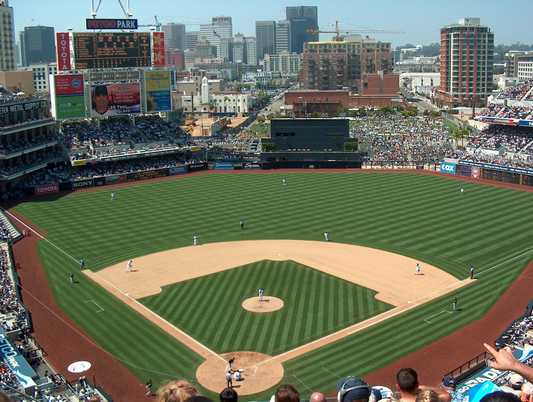 The field at Petco Park with the downtown San Diego skyline rising beyond the outfield