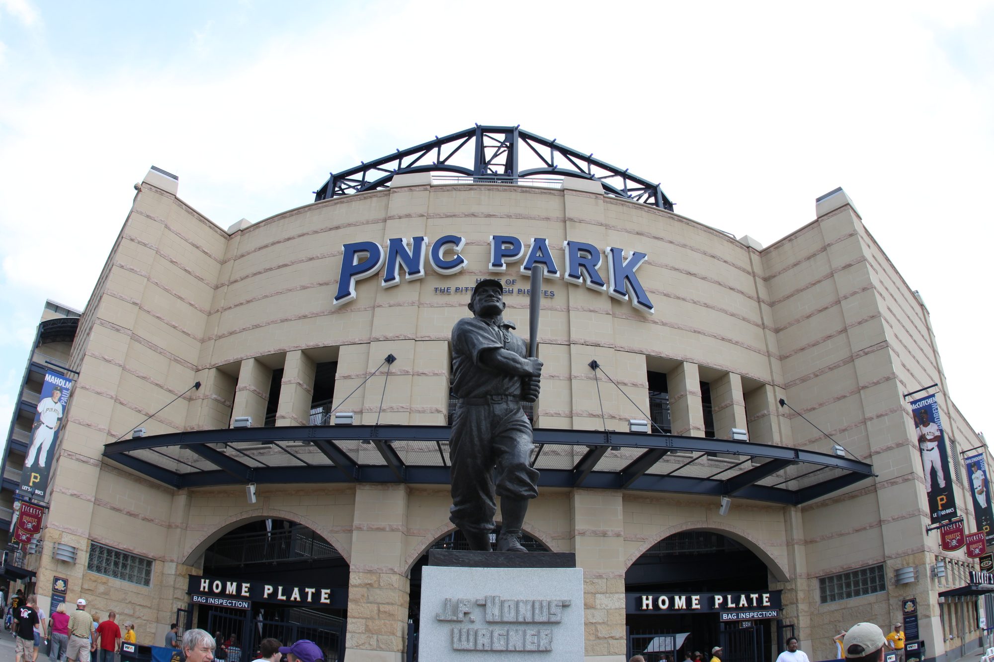 The Honus Wagner statue outside the Home Plate gate at PNC Park, beneath the PNC PARK sign