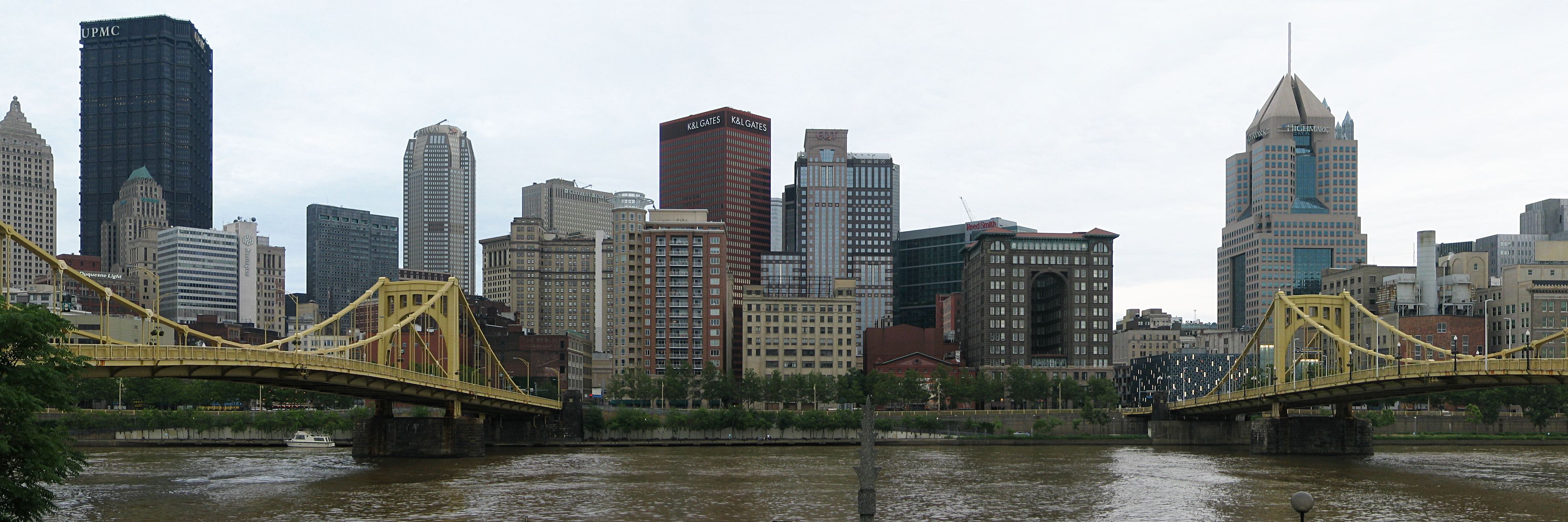 A panorama of the downtown Pittsburgh skyline from the North Shore, with the yellow bridges over the Allegheny River