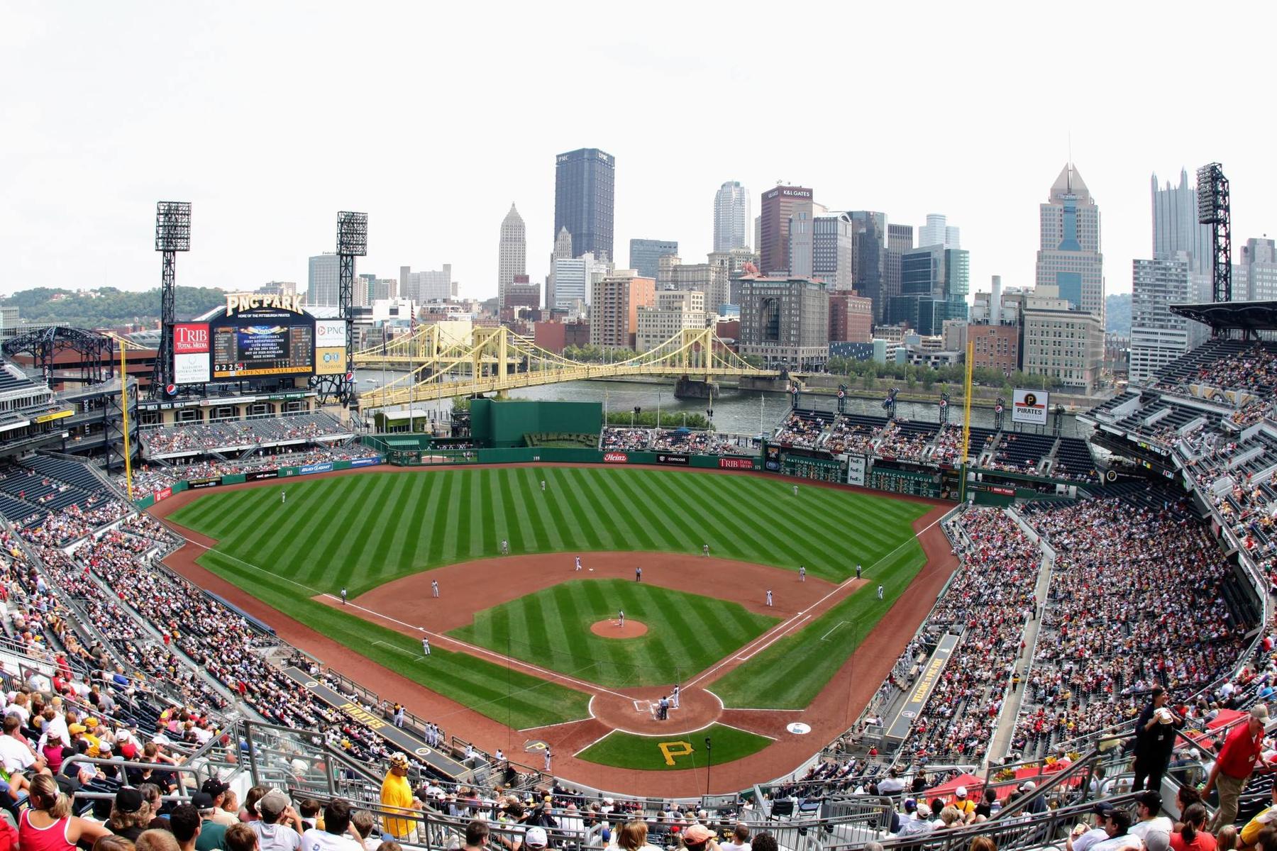 The Pittsburgh skyline and the bridges over the Allegheny River beyond the outfield at PNC Park