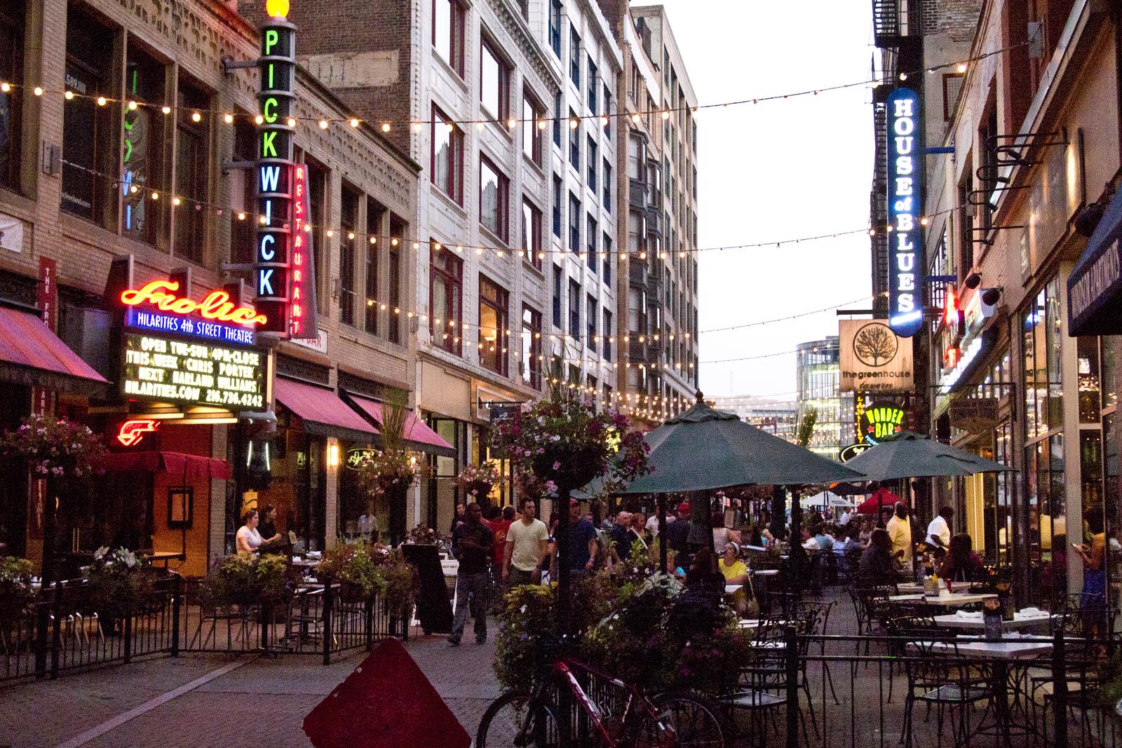 East 4th Street in downtown Cleveland, the pedestrian dining alley near Progressive Field, patios and restaurant marquees down both sides of the block