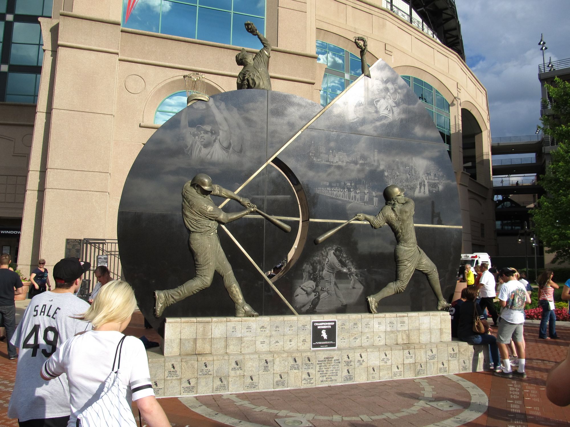 The bronze sculpture at Champions Plaza outside Rate Field, with fans walking past on a game day