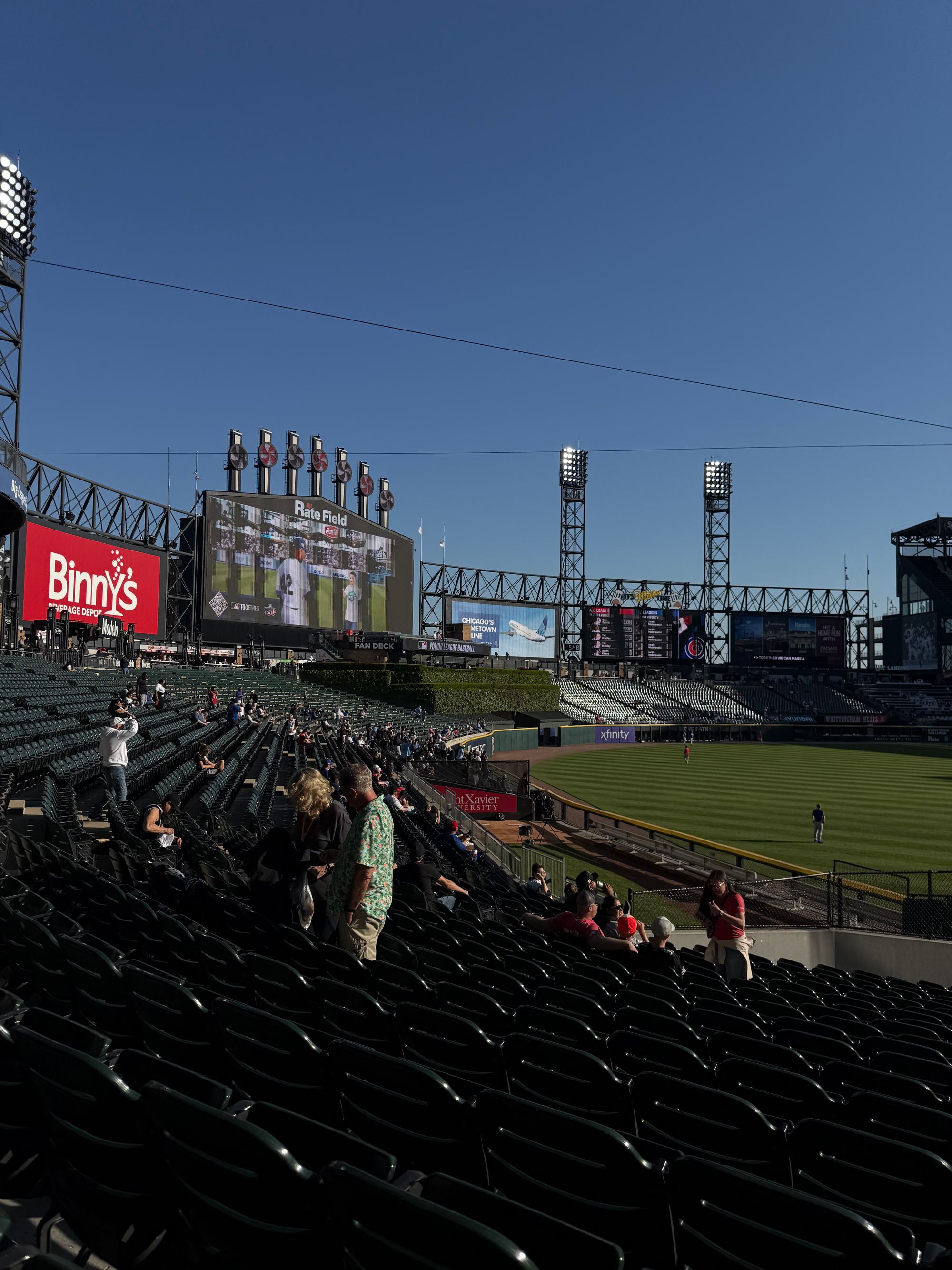 The scoreboard and seats at Rate Field during a day game