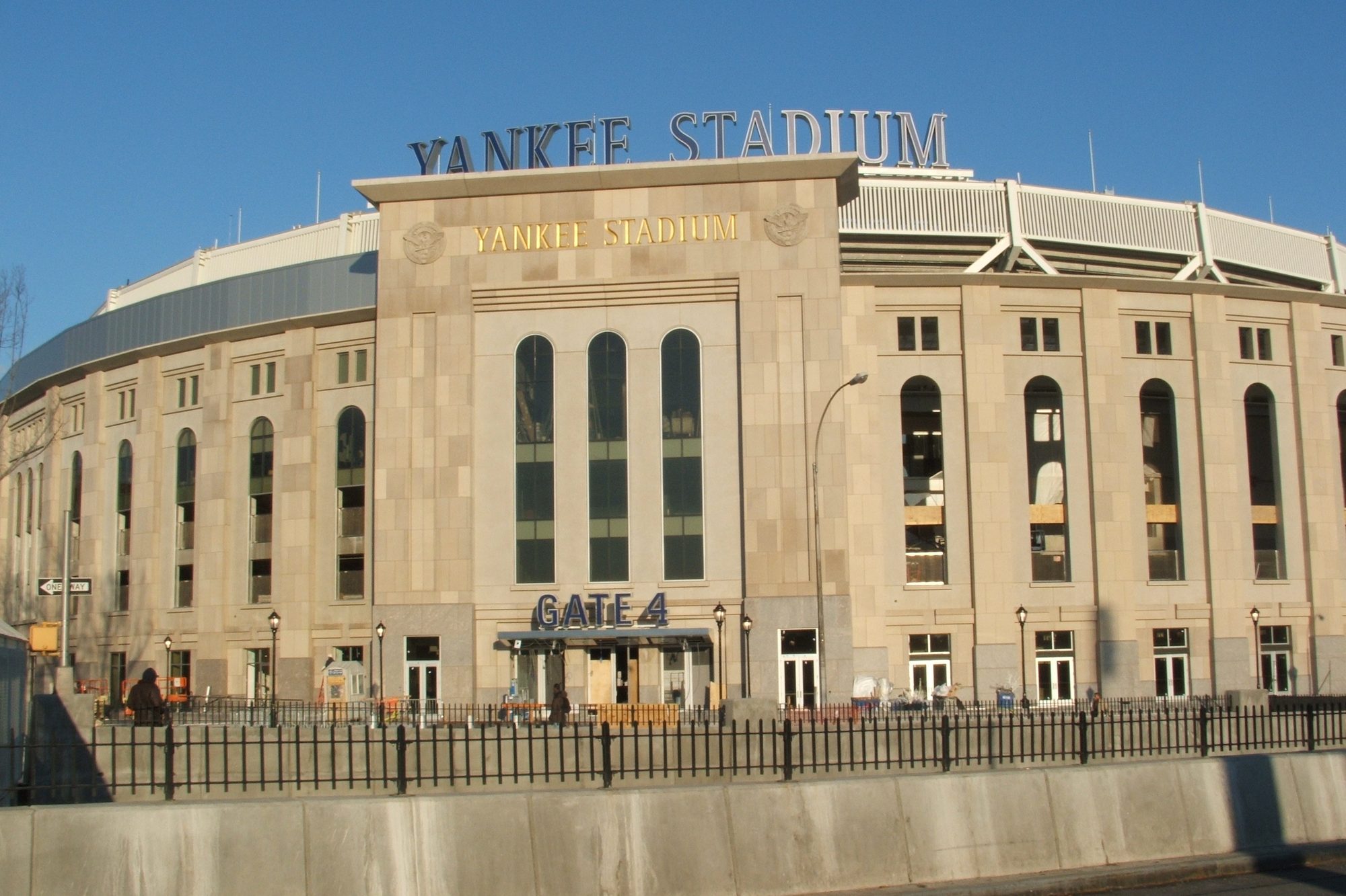 The limestone facade of Yankee Stadium with the Gate 4 entrance and the gold Yankee Stadium lettering